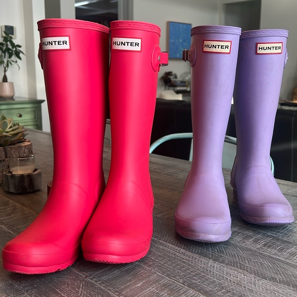 Two pairs of kids Hunter boots.